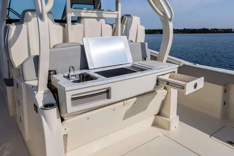 Slide: The Image of Manufacturer Provided Image: 2025 Scout 400 LXF Li-Ion boat with outdoor kitchen and sink on deck. - 8