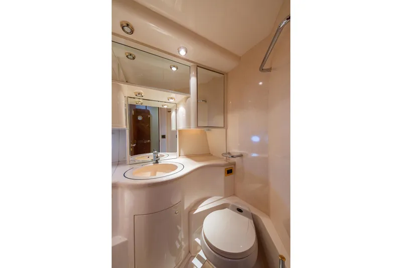 Slide: The Image of Luxurious bathroom interior of 1999 Azimut 58 yacht, featuring modern fixtures and elegant design. - 30