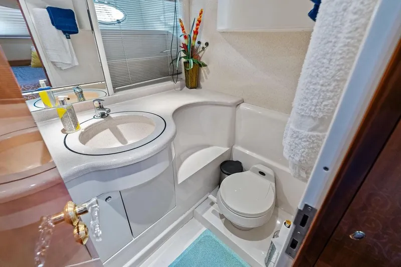 Slide: The Image of Luxurious bathroom in 1999 Azimut 58 yacht with modern fixtures and elegant decor. - 32