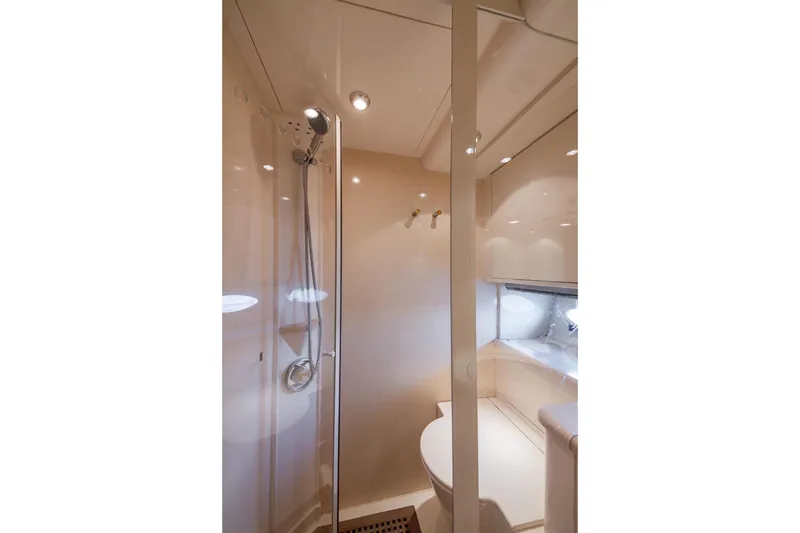 Slide: The Image of Bathroom interior of 1999 Azimut 58 yacht, featuring a shower and modern fixtures. - 34