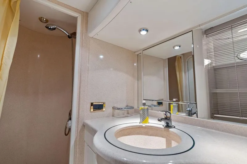 Slide: The Image of Luxurious bathroom in a 1999 Azimut 58 yacht with modern fixtures and shower. - 35