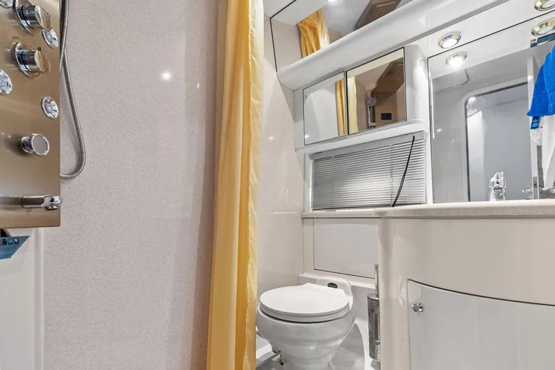 Slide: The Image of Luxurious bathroom in a 1999 Azimut 58 yacht, featuring modern fixtures and elegant design. - 36