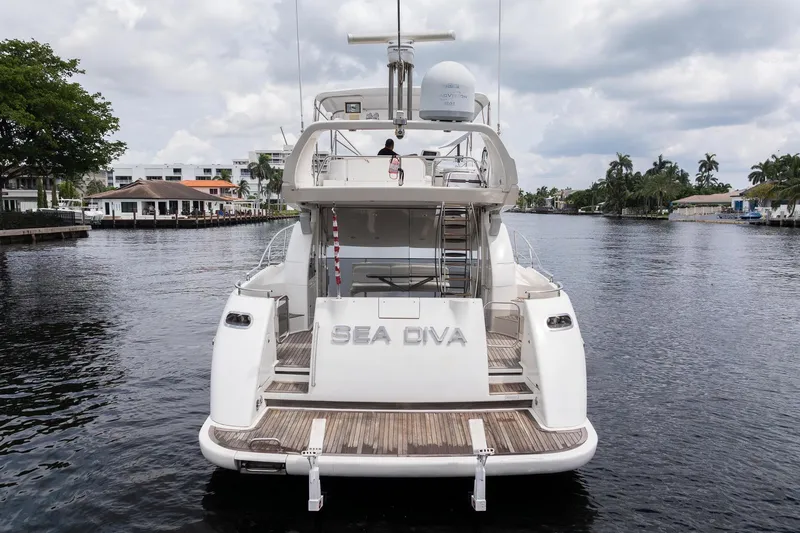 Slide: The Image of 1999 Azimut 58 yacht "Sea Diva" docked on a calm waterway. - 4