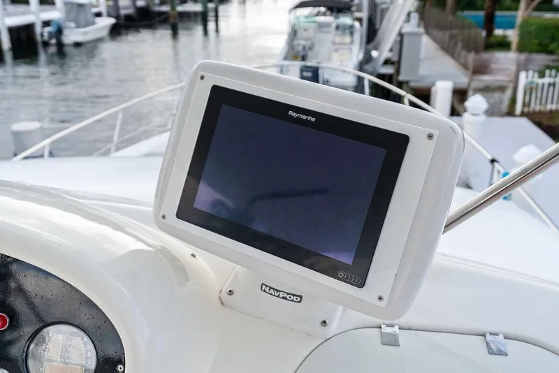 Slide: The Image of Raymarine navigation display on 1999 Azimut 58 yacht, docked at marina. - 49