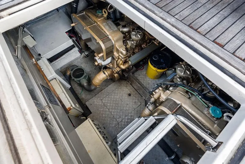 Slide: The Image of Engine room of a 1999 Azimut 58 yacht, showcasing mechanical components. - 58