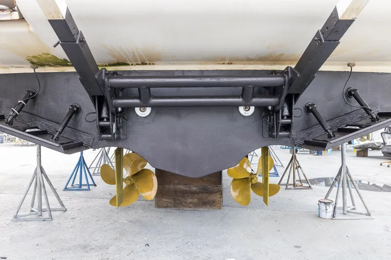 Slide: The Image of Underwater view of 1999 Azimut 58 yacht's propellers and rudder system on stands. - 61