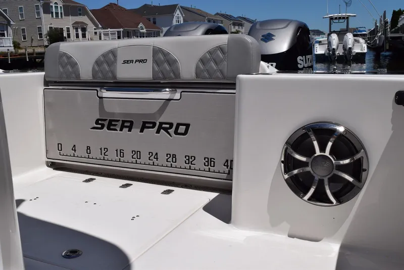 Slide: The Image of 2021 Sea Pro 320 DLX Center Console boat interior with speaker and branded seating. - 16