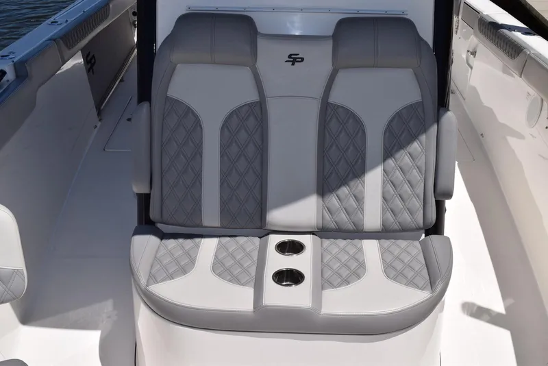 Slide: The Image of 2021 Sea Pro 320 DLX Center Console boat seating with cup holders and quilted upholstery. - 23