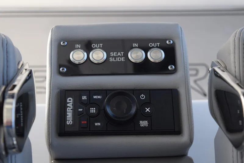 Slide: The Image of Simrad control panel and seat slide buttons on 2021 Sea Pro 320 DLX Center Console. - 26