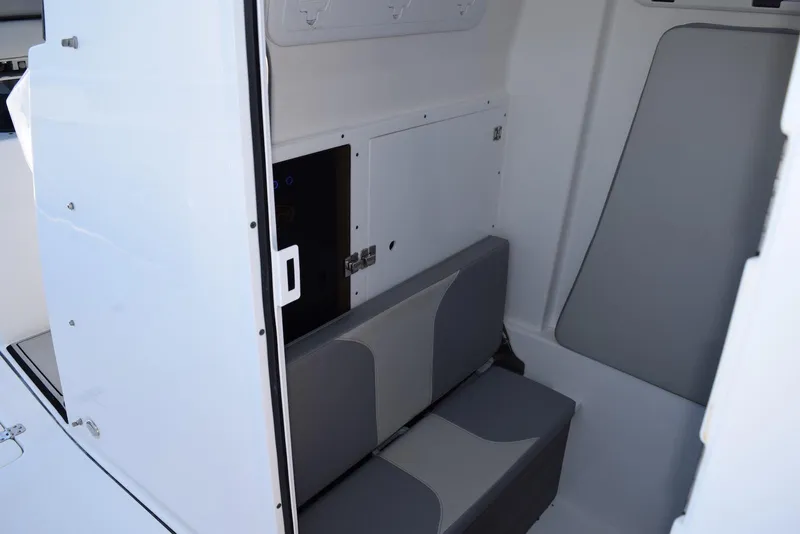 Slide: The Image of Interior of 2021 Sea Pro 320 DLX Center Console with seating and storage. - 34