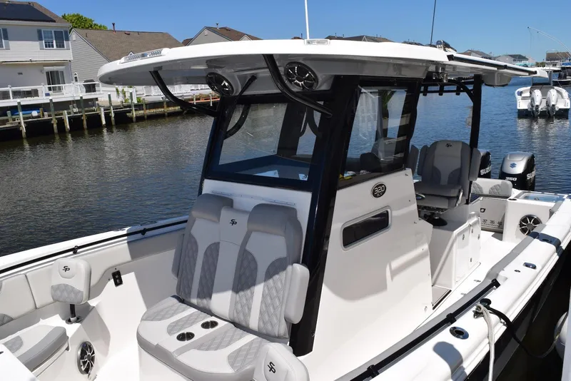 Slide: The Image of 2021 Sea Pro 320 DLX Center Console boat docked in a marina. - 35