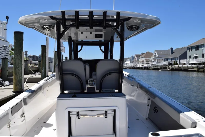Slide: The Image of 2021 Sea Pro 320 DLX Center Console interior with life jackets, toilet, and sink. - 38