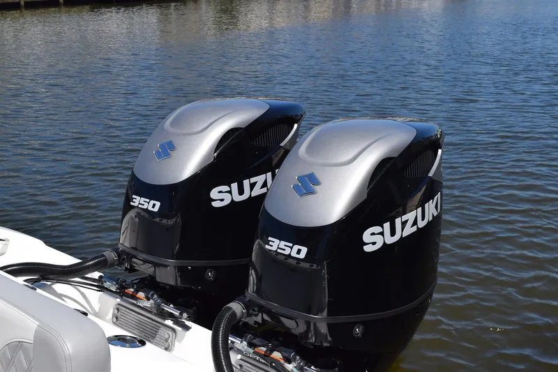 Slide: The Image of Twin Suzuki 350 outboard engines on a 2021 Sea Pro 320 DLX Center Console boat. - 40