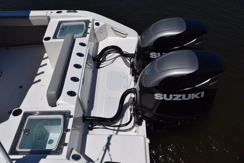 Slide: The Image of 2021 Sea Pro 320 DLX Center Console with dual Suzuki outboard motors. - 41