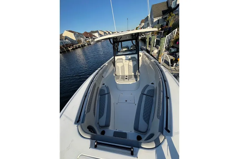 Slide: The Image of 2021 Sea Pro 320 DLX Center Console boat docked in a residential canal. - 6
