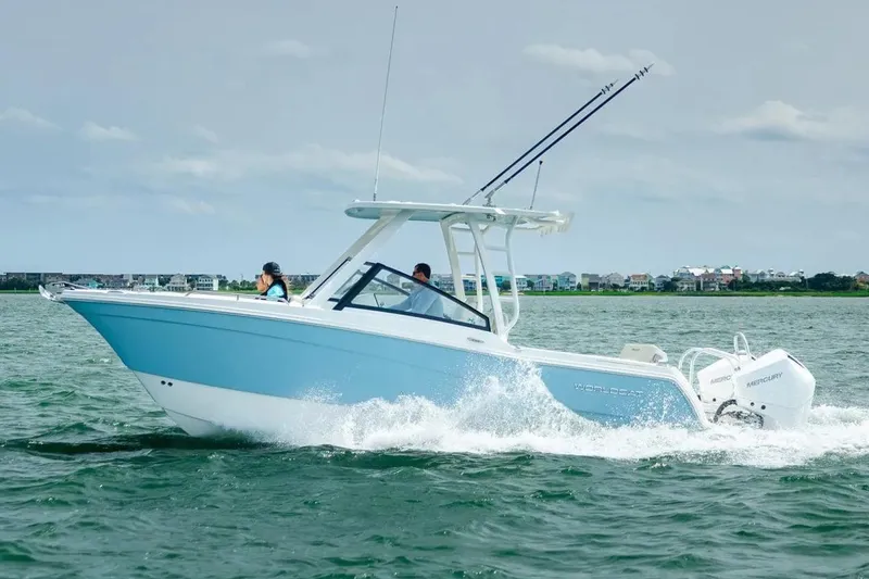 The Image of Manufacturer Provided Image: 2026 World Cat 265 DC-X boat cruising on water, featuring sleek design and dual Mercury engines. - 0
