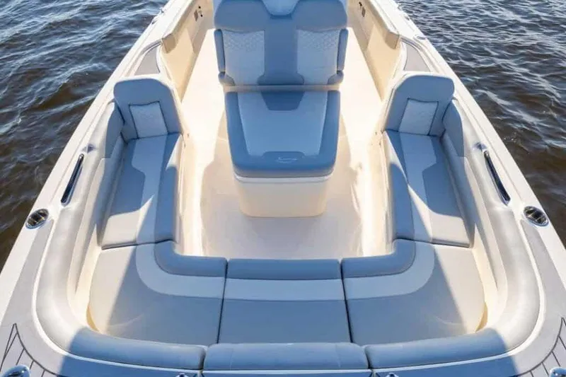 Slide: The Image of Manufacturer Provided Image: 2025 Scout 281 XSS boat interior with luxurious seating on water. - 7