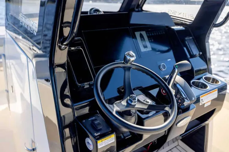 Slide: The Image of Manufacturer Provided Image: 2025 Scout 281 XSS boat dashboard with steering wheel and controls. - 9