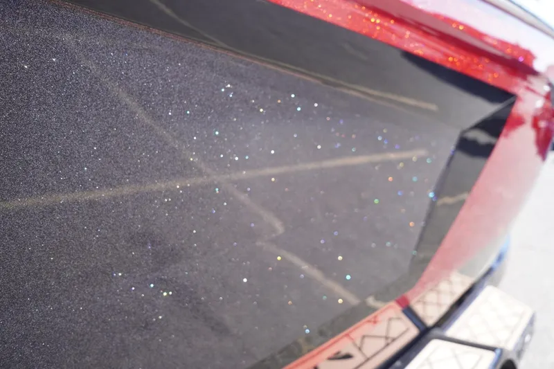 Slide: The Image of Close-up of 2022 Tigé 22RZX boat with sparkling metallic finish. - 10