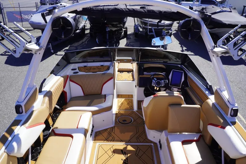 Slide: The Image of 2022 Tigé 22RZX boat interior with luxurious seating and modern dashboard. - 14