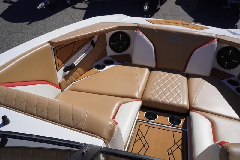 Slide: The Image of Luxurious interior of 2022 Tigé 22RZX boat with tan and white seating. - 24