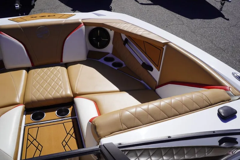 Slide: The Image of Luxurious interior of 2022 Tigé 22RZX boat with tan and white seating. - 25