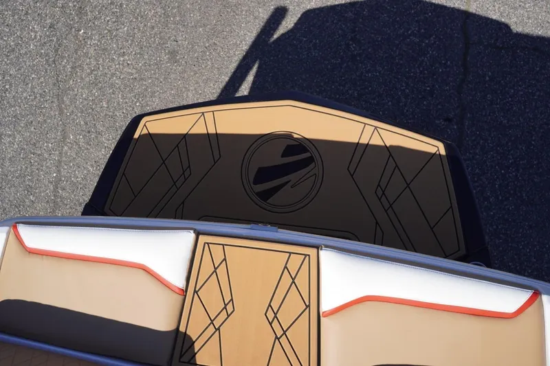 Slide: The Image of 2022 Tigé 22RZX boat deck with stylish geometric design and cushioned seating. - 27