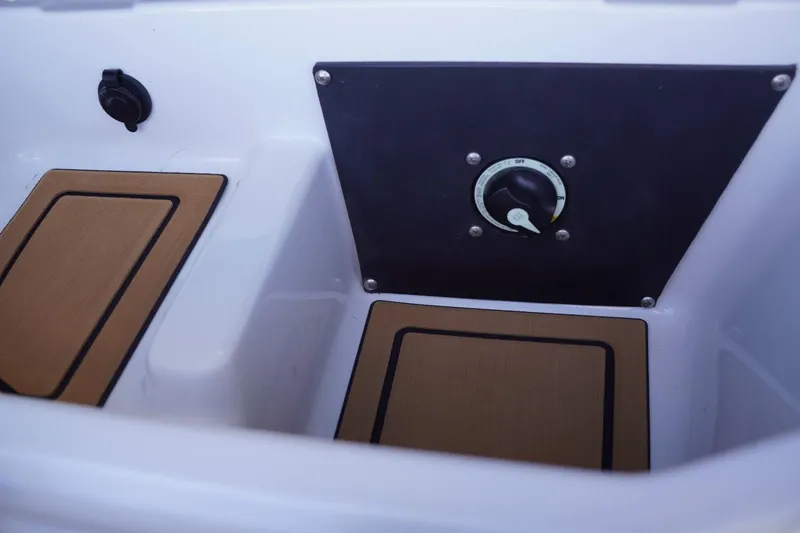 Slide: The Image of 2022 Tigé 22RZX boat interior with control panel and seating area. - 30
