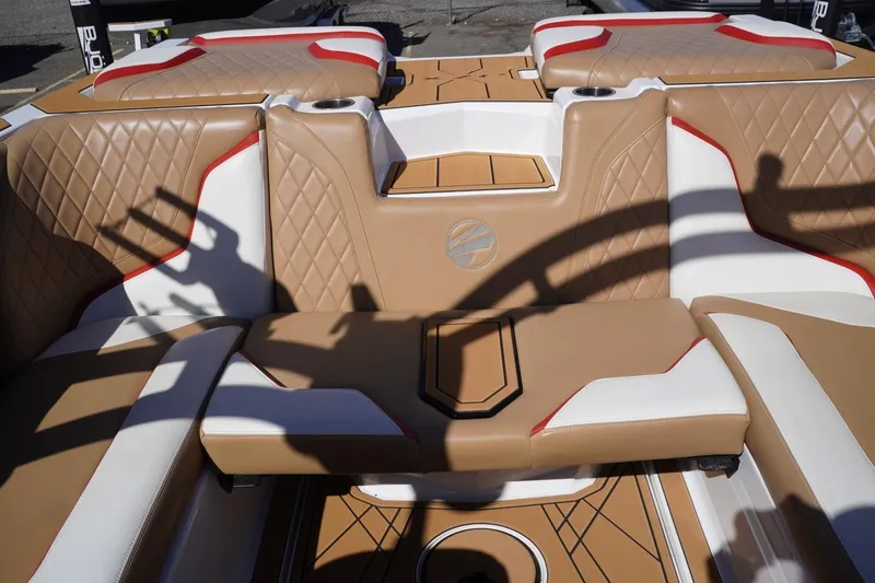 Slide: The Image of 2022 Tigé 22RZX boat interior with tan and white upholstery, featuring diamond stitching. - 36