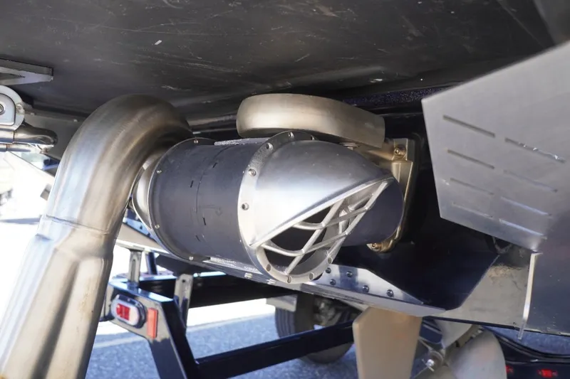 Slide: The Image of 2022 Tigé 22RZX boat exhaust system and propeller detail. - 56