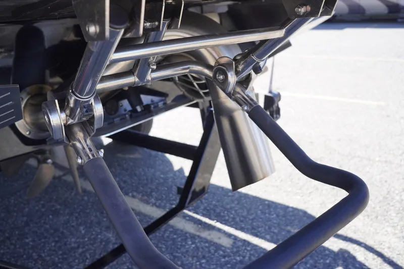 Slide: The Image of Close-up of 2022 Tigé 22RZX boat's rear metal components and propeller. - 57