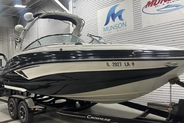 The Image of 2019 Crownline Eclipse E255 SURF boat on trailer in showroom. - 0