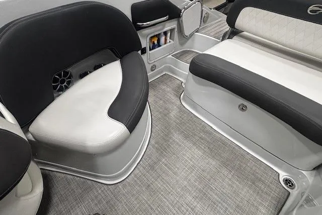 Slide: The Image of Interior seating of 2019 Crownline Eclipse E255 SURF boat, featuring gray and white upholstery. - 13