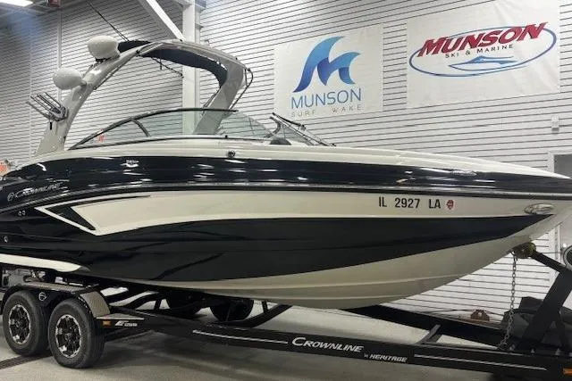 Slide: The Image of 2019 Crownline Eclipse E255 SURF boat on trailer in showroom. - 2