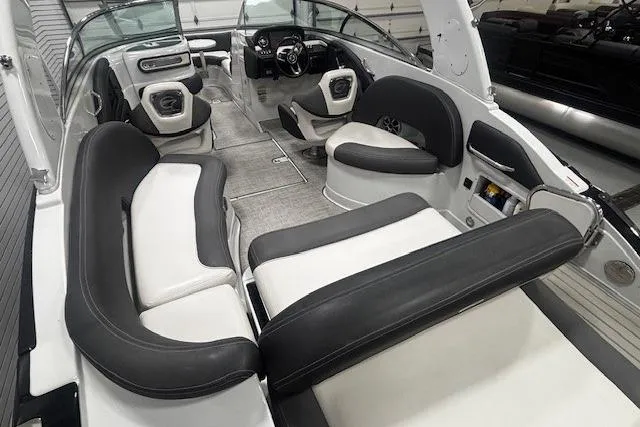 Slide: The Image of 2019 Crownline Eclipse E255 SURF boat interior with luxurious seating and modern dashboard. - 32