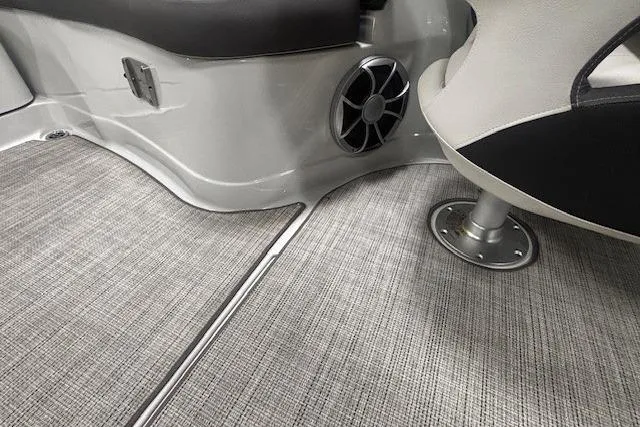 Slide: The Image of 2019 Crownline Eclipse E255 SURF interior with speaker and textured flooring. - 35