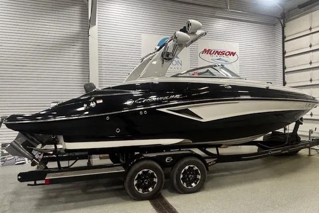 Slide: The Image of 2019 Crownline Eclipse E255 SURF boat on trailer in showroom. - 43