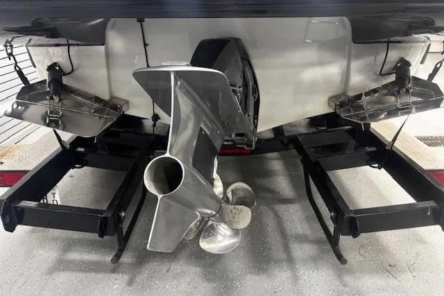 Slide: The Image of 2019 Crownline Eclipse E255 SURF boat stern with propeller and trailer. - 44