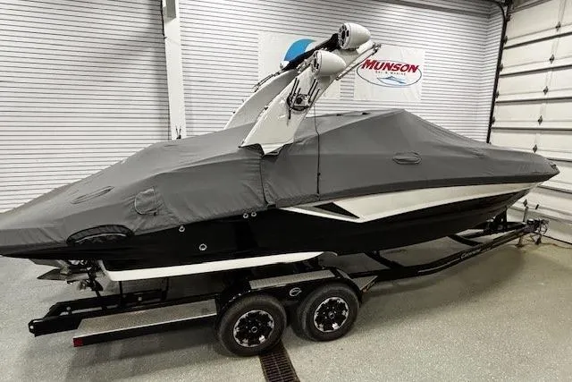 Slide: The Image of 2019 Crownline Eclipse E255 SURF boat with cover on trailer in garage. - 47