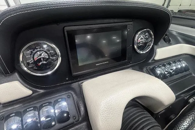 Slide: The Image of Dashboard of 2019 Crownline Eclipse E255 SURF boat with gauges and controls. - 6
