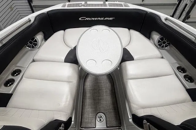 Slide: The Image of 2019 Crownline Eclipse E255 SURF boat interior with white seating and central table. - 8