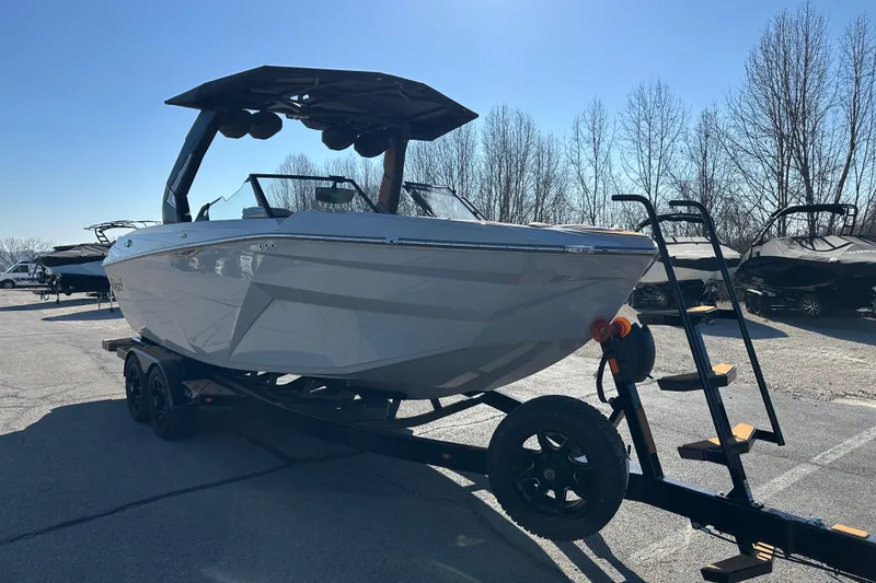 The Image of 2026 Tigé Z3 boat on trailer, parked outdoors under clear blue sky. - 0
