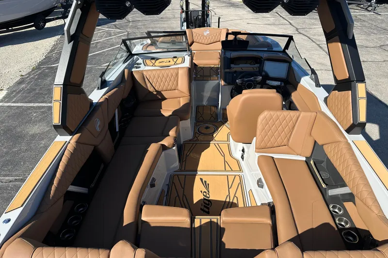 Slide: The Image of 2026 Tigé Z3 boat interior with luxurious tan seating and modern dashboard. - 11