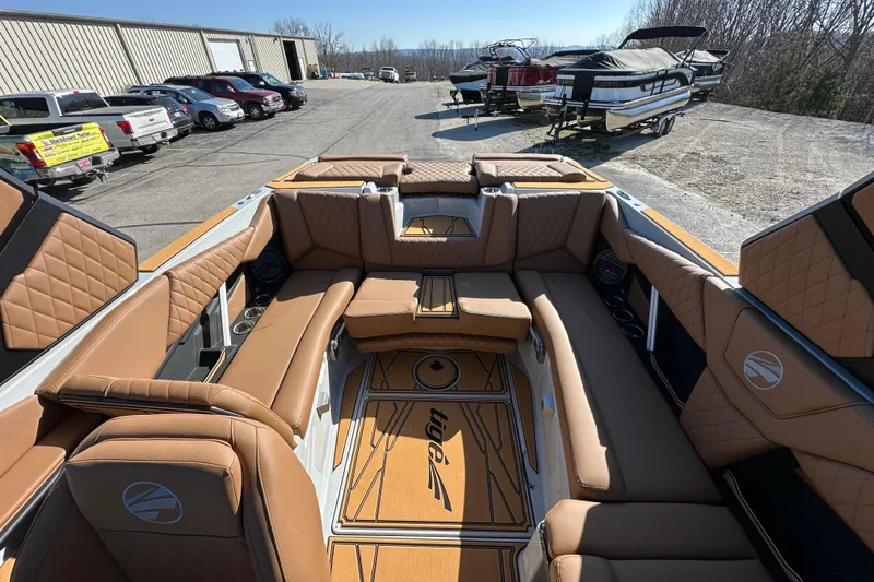 Slide: The Image of Luxurious interior of 2026 Tigé Z3 boat with tan leather seating and stylish design. - 13