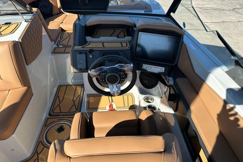 Slide: The Image of 2026 Tigé Z3 boat interior with tan leather seats and modern dashboard. - 15