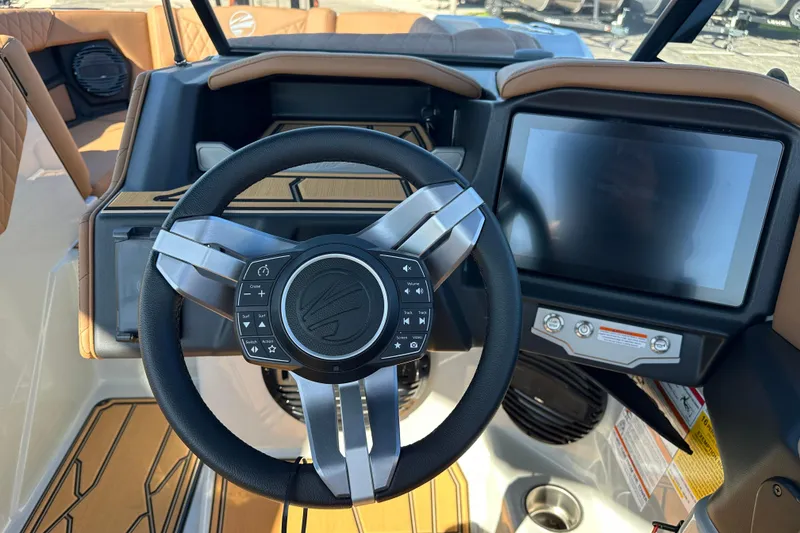 Slide: The Image of 2026 Tigé Z3 boat dashboard with steering wheel and touchscreen display. - 16