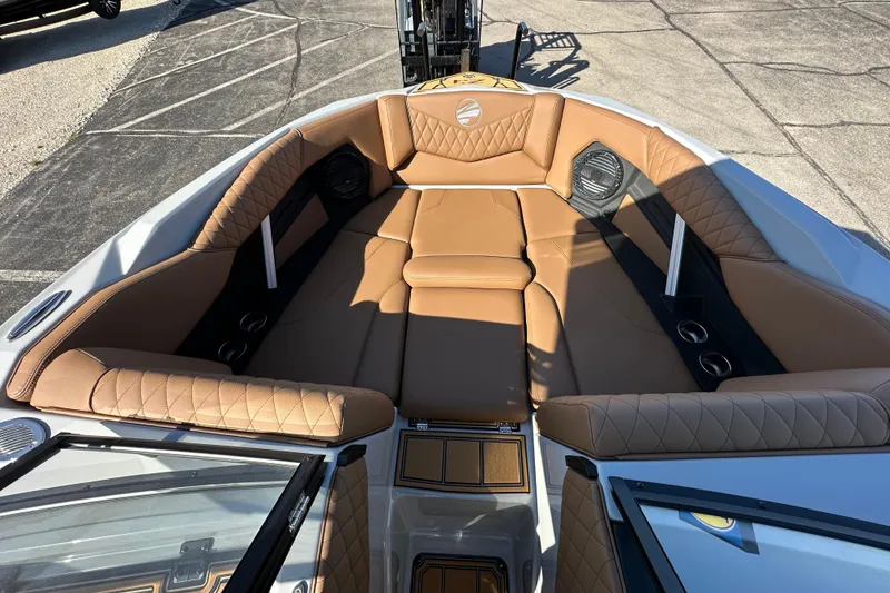 Slide: The Image of Luxurious interior of 2026 Tigé Z3 boat with tan leather seating and cup holders. - 17