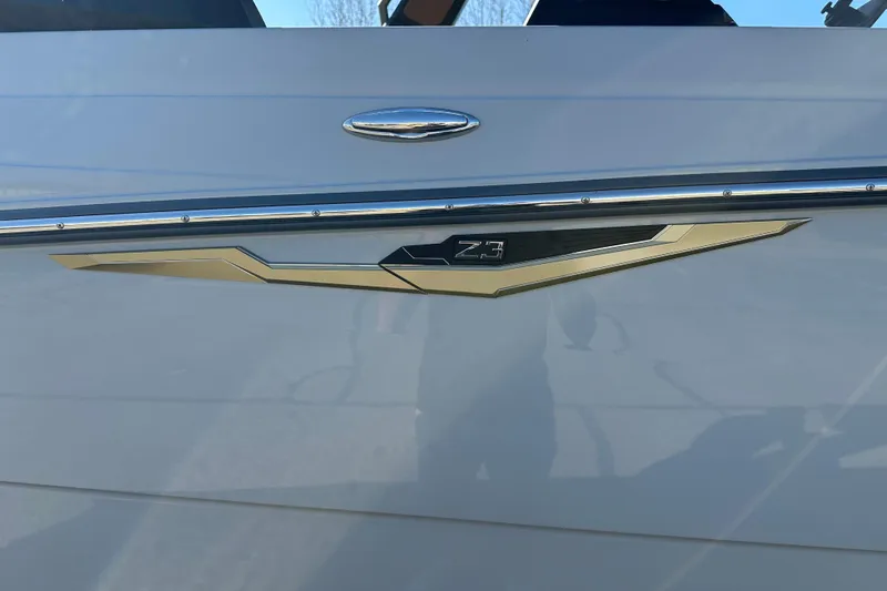 Slide: The Image of 2026 Tigé Z3 boat emblem on sleek white exterior. - 2