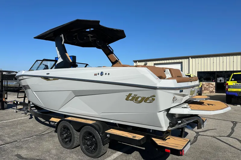 Slide: The Image of 2026 Tigé Z3 boat on trailer, parked outdoors under clear blue sky. - 5