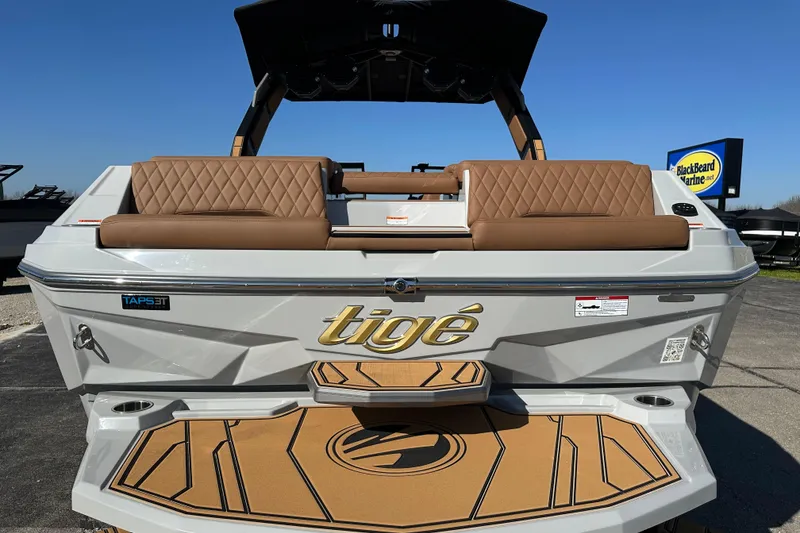 Slide: The Image of 2026 Tigé Z3 boat with brown seating and TAPS 3T technology, displayed outdoors. - 8